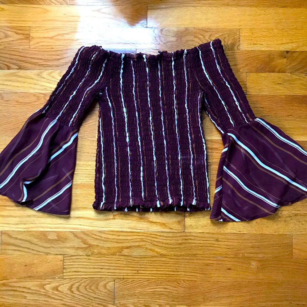 Stretchy off shoulder top with flared sleeves